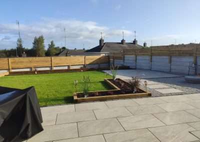 large patio slabs with dark border, custom Walkway, planters, fencing and full garden design