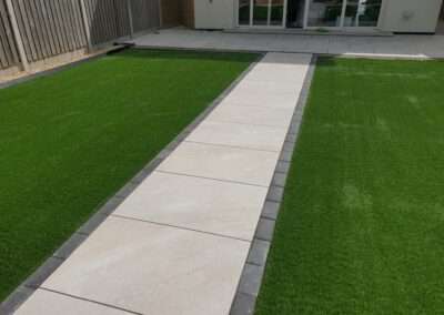 Professional garden design Waterford. Patio, walkway, edging and artificial grass installation.